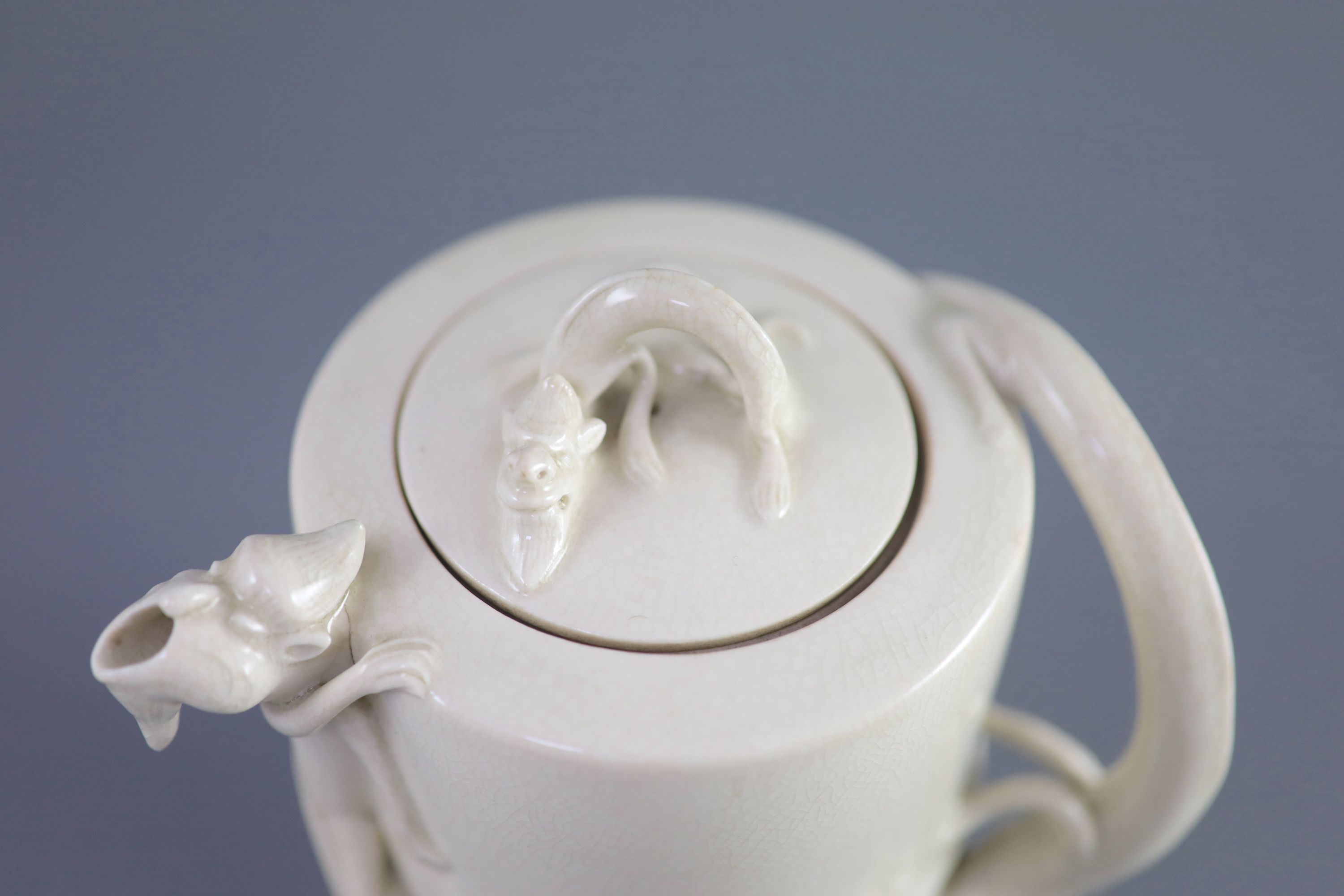 A Chinese soft-paste blanc-de-chine wine ewer, 19th century, 15.5cm high